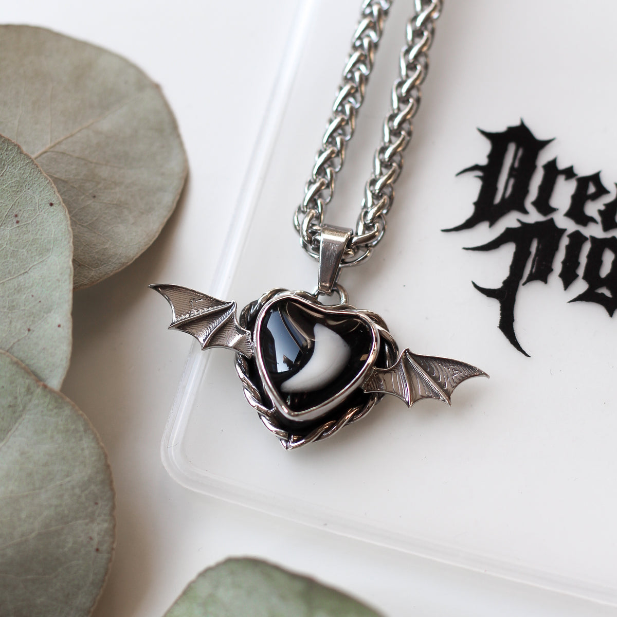 Bat wing tooth keepsake necklace